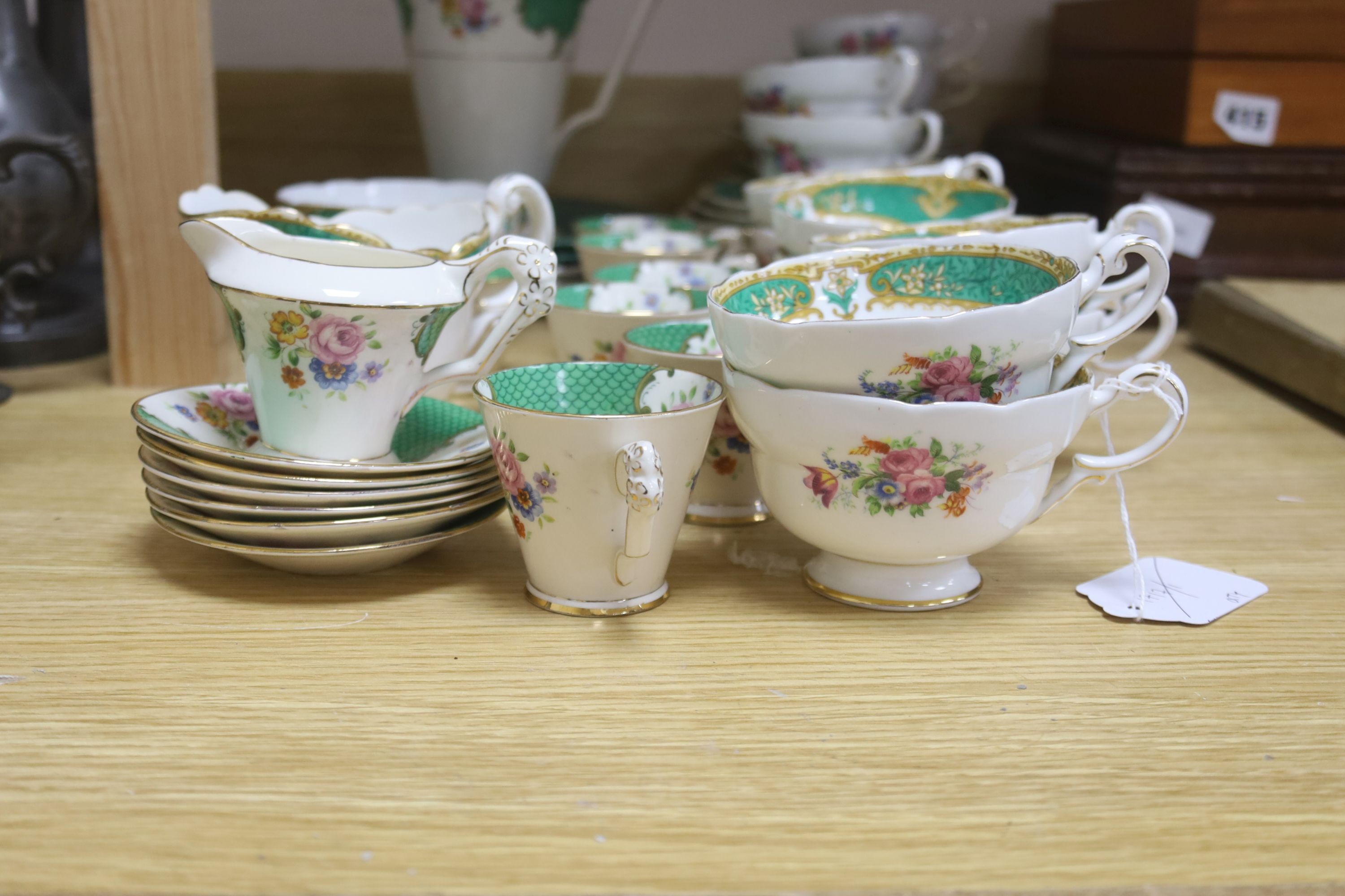 A quantity of Paragon bone china 15 piece part tea and coffee set and two Victorian green glazed wicker effect plates